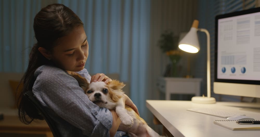 woman holding dog