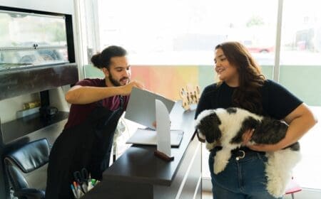 A woman talking to a man to find out how much does service dog training cost for anxiety.
