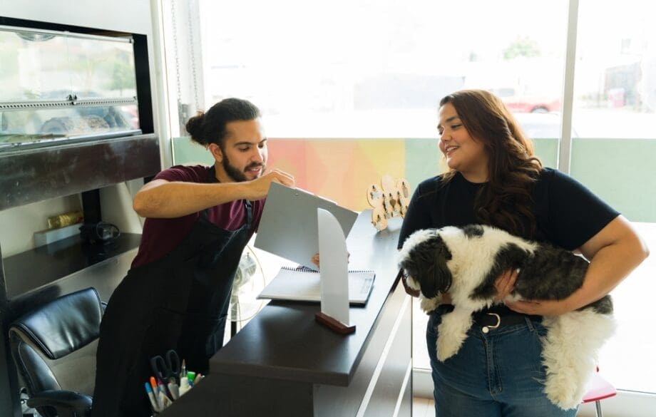 A woman talking to a man to find out how much does service dog training cost for anxiety.