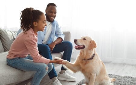 A family interacting with their emotional support dog in Mississippi.