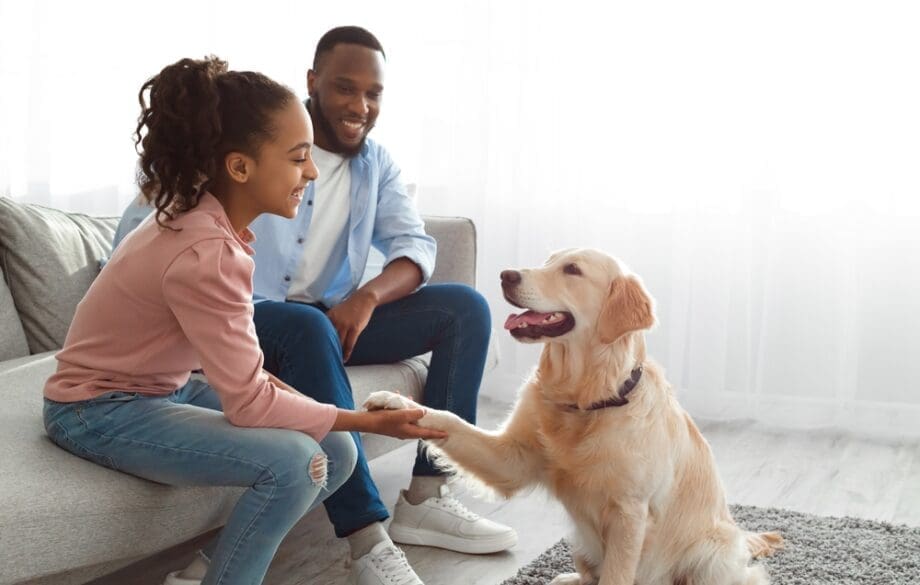 A family interacting with their emotional support dog in Mississippi.